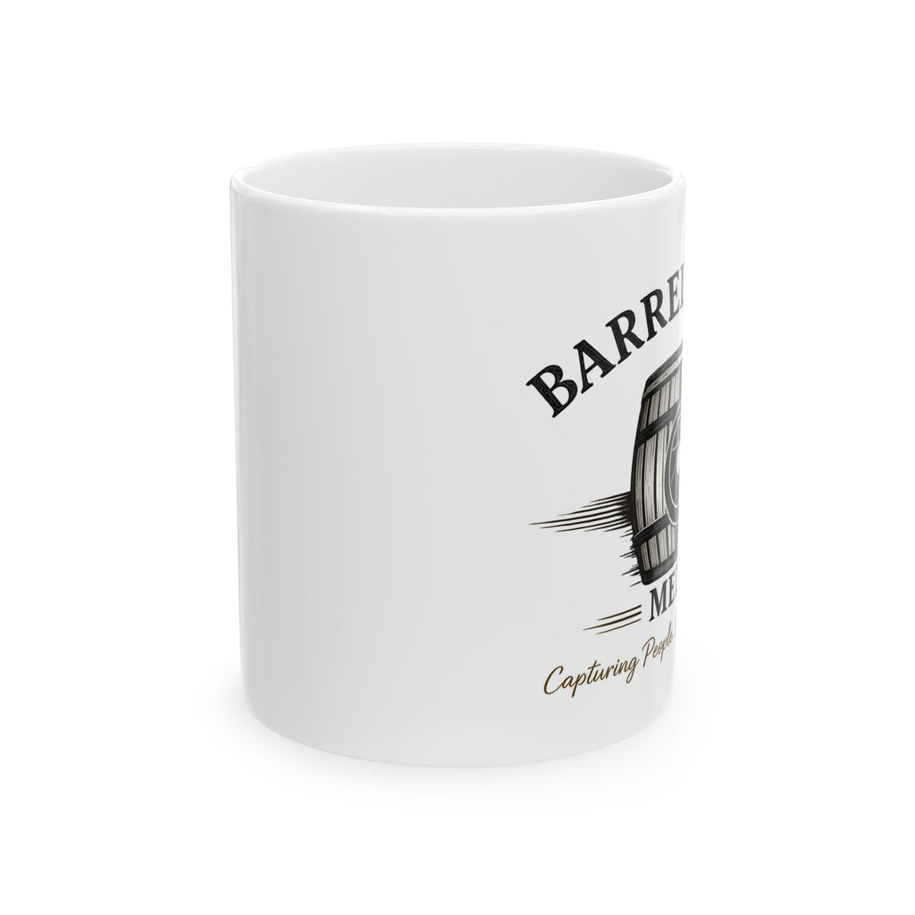 White ceramic coffee mug from Barrelhouse Media, featuring a hand-drawn barrel and vintage label on the side.