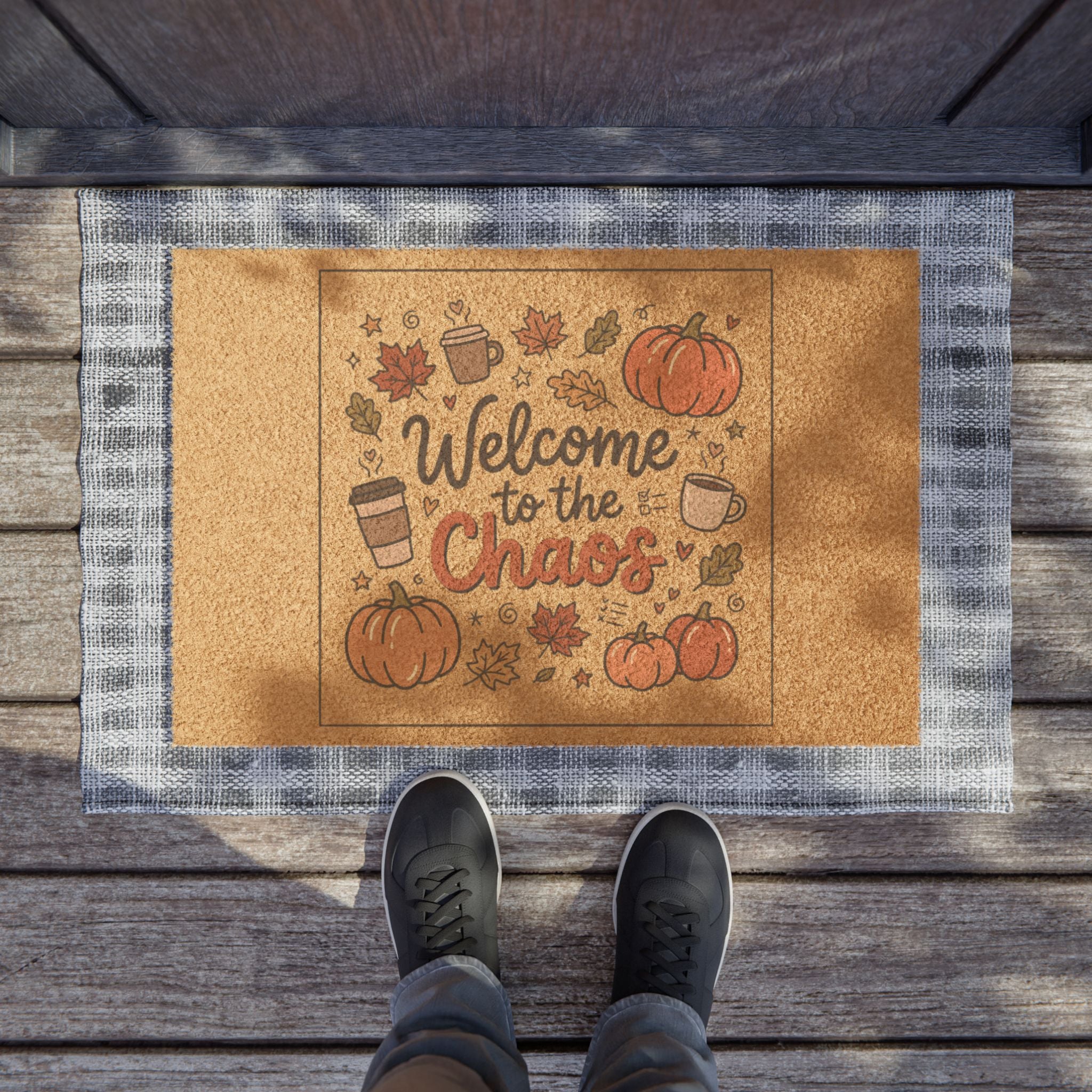 Fall-themed coir doormat with "Welcome to the Chaos" text, pumpkins, coffee cups, and autumn leaves.
