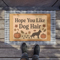 Hope You Like Dog Hair Doormat with autumn pumpkins, falling leaves, paw prints, and a dog silhouette.