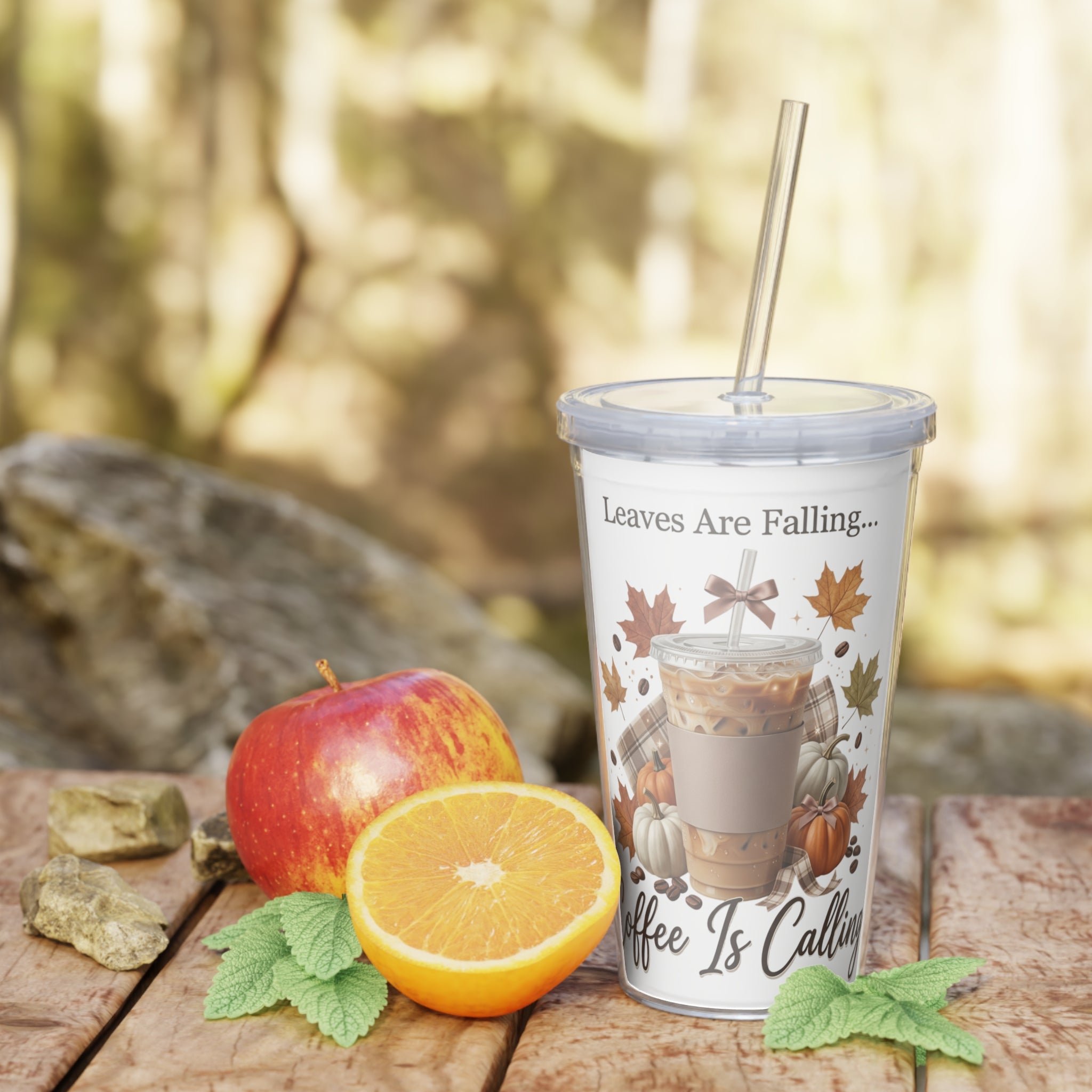 Front view of a 20oz plastic tumbler with a straw, featuring "Leaves Are Falling... Coffee Is Calling" text and fall-themed art.